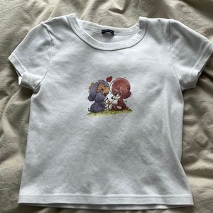 White baby tee with puppy dogs.
